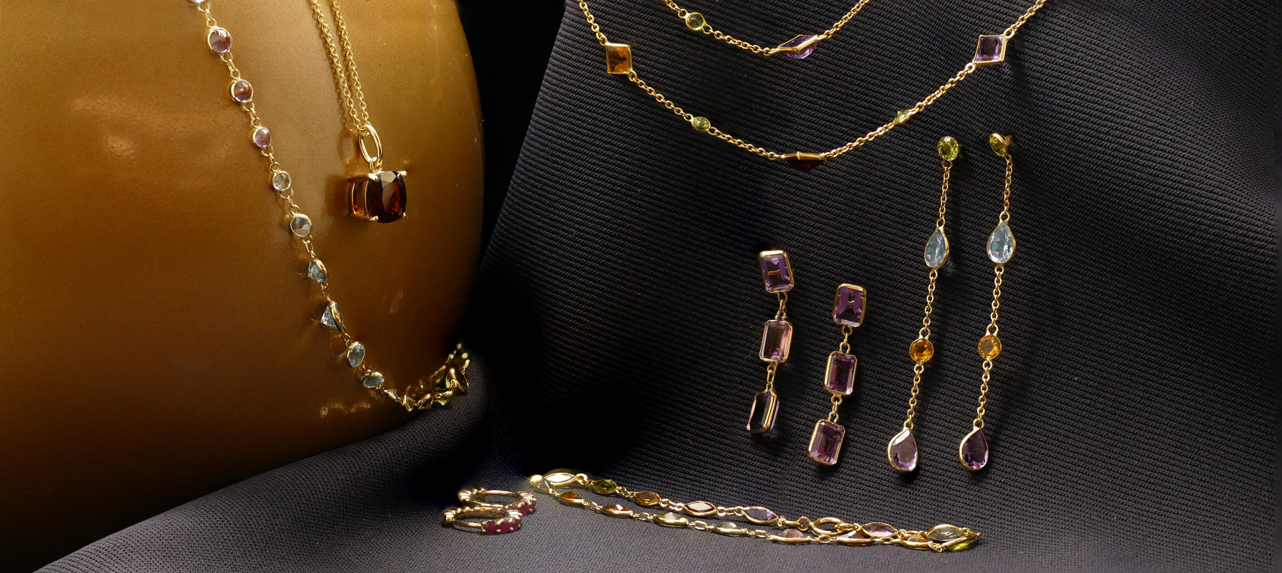 coloured gemstone necklaces, earrings, pendants, rings and bracelets crafted in gold or luscious platinum. 