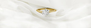 Round Brilliant Cut Diamond Engagement Rings in 18ct yellow gold and platinum
