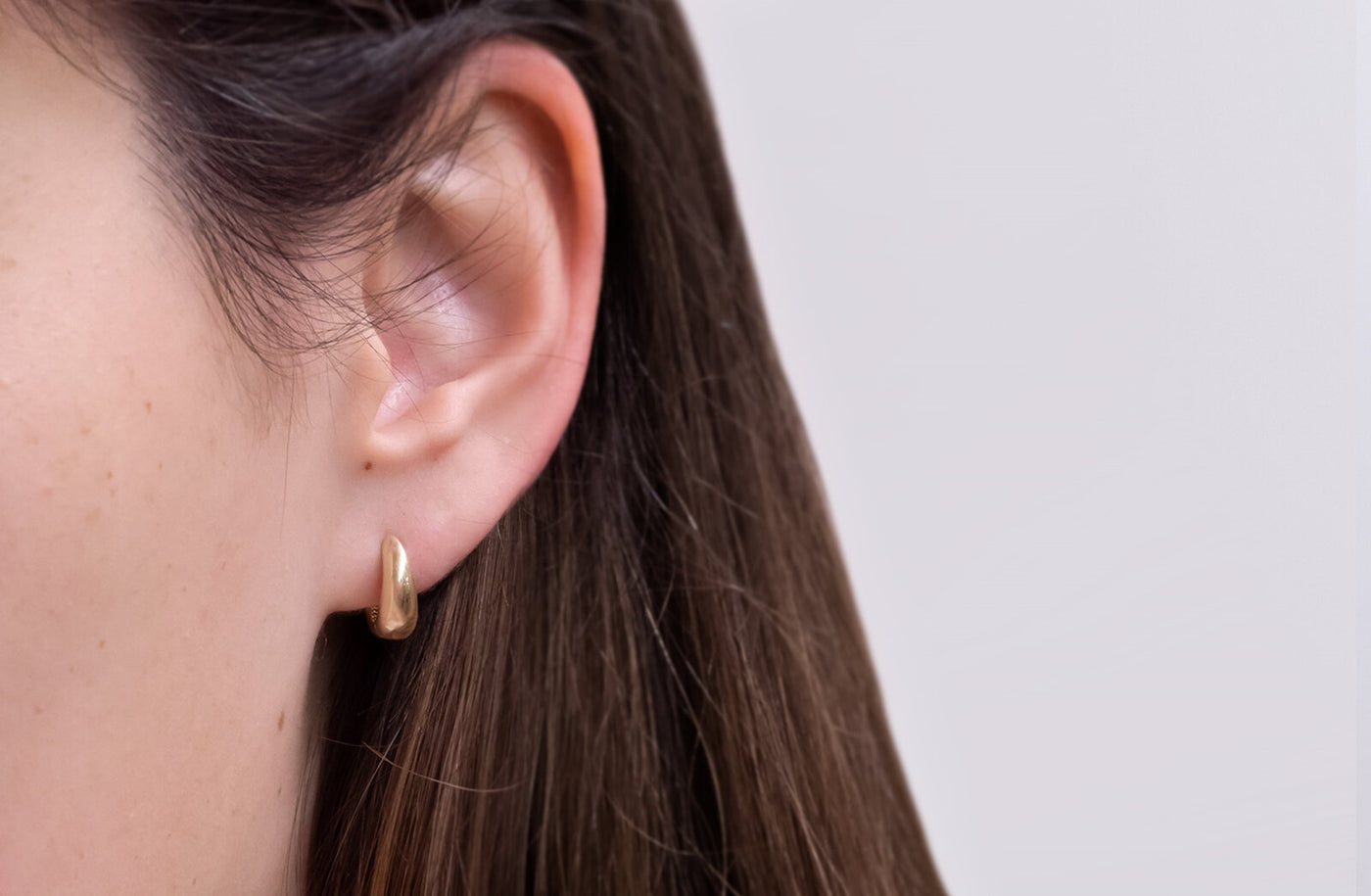 Tapered Huggie Earrings in Gold