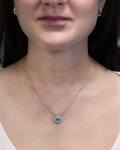 Oval Cut Aquamarine and Diamond Halo Pendant in Platinum | 2.07ctw