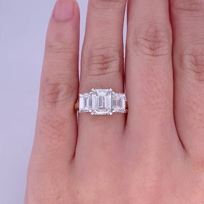 Erté: Emerald Cut Diamond Three Stone Ring in Yellow Gold | 4.04ctw