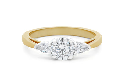 Reflect: Brilliant Cut Diamond Three Stone Ring.