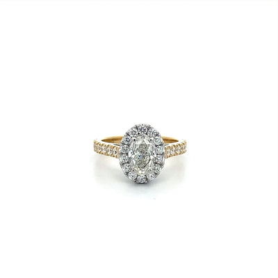 Adorn: Oval Cut Diamond Halo Ring with Diamond Set Band